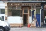 Pretswell's signage being uncovered in 2013.
